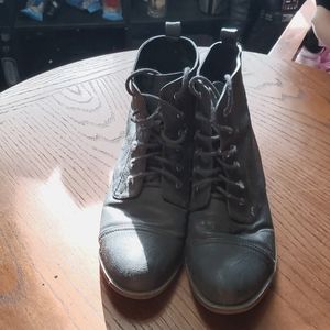 Black faux leather lace up boots